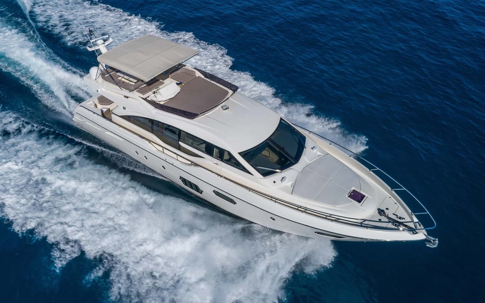 Aerial view of the Ferretti 690 running across deep blue water off Oahu.