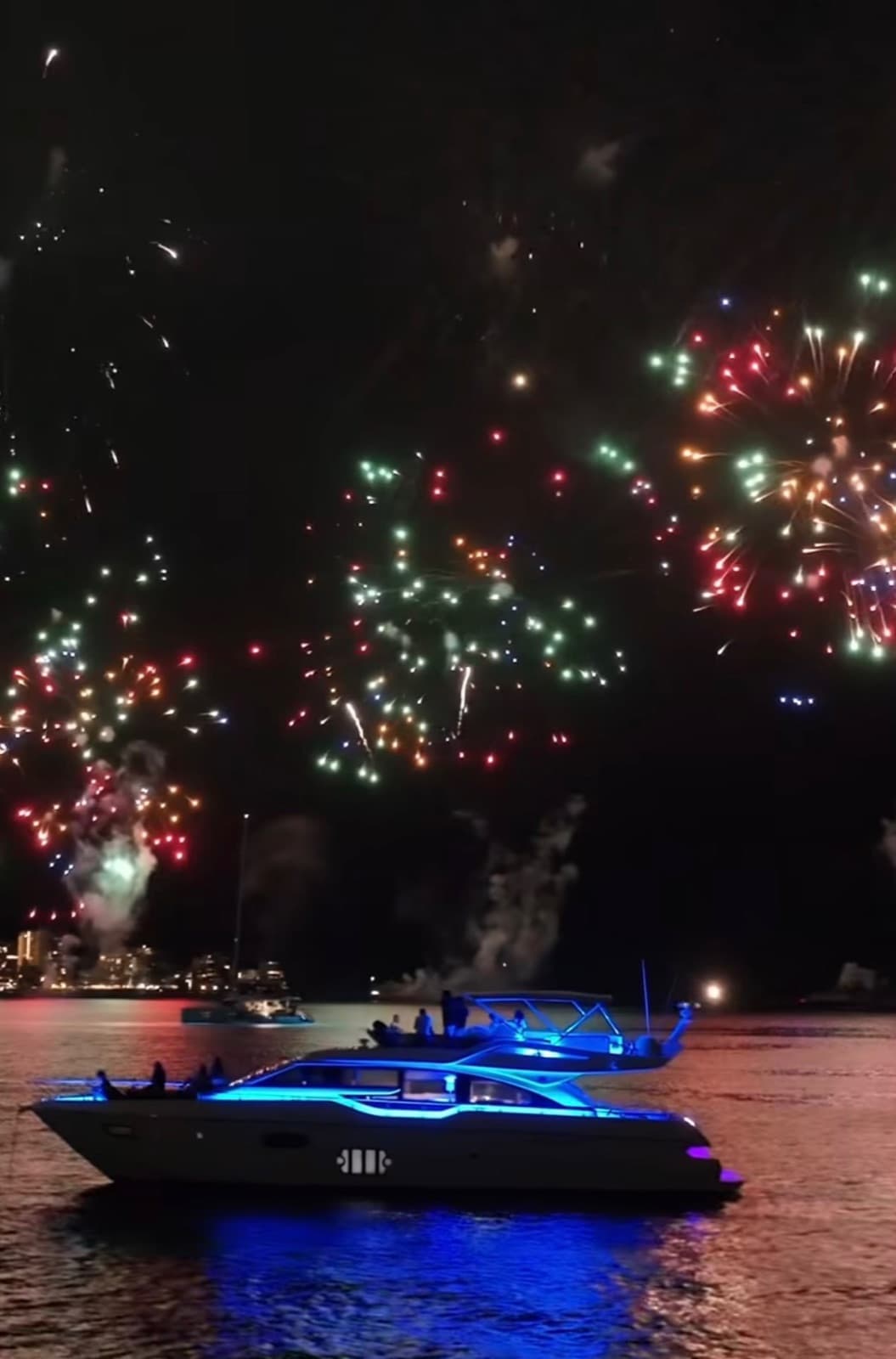 The yacht anchored off Waikiki under the Friday-night fireworks.