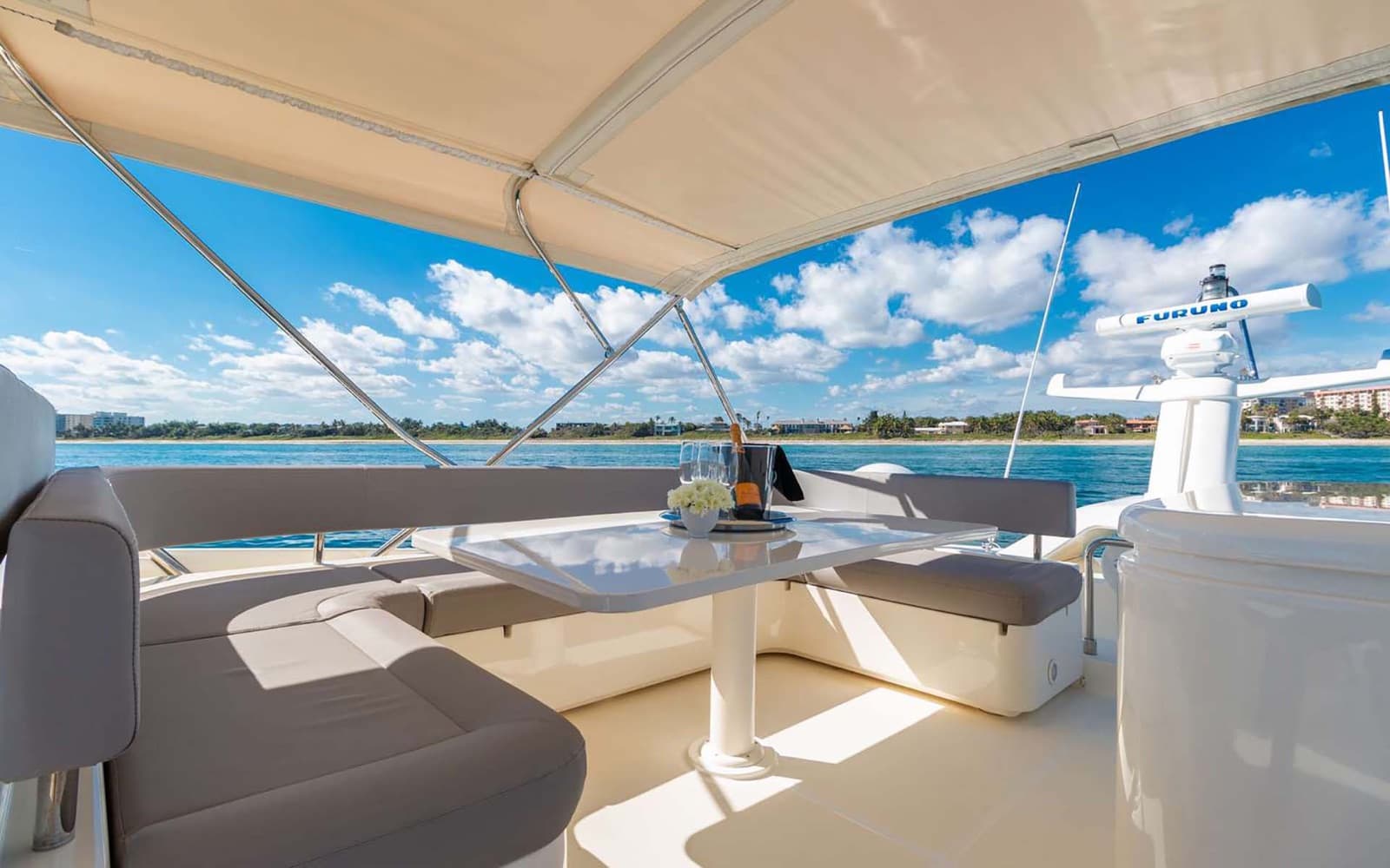 Champagne chilling on the shaded flybridge lounge.