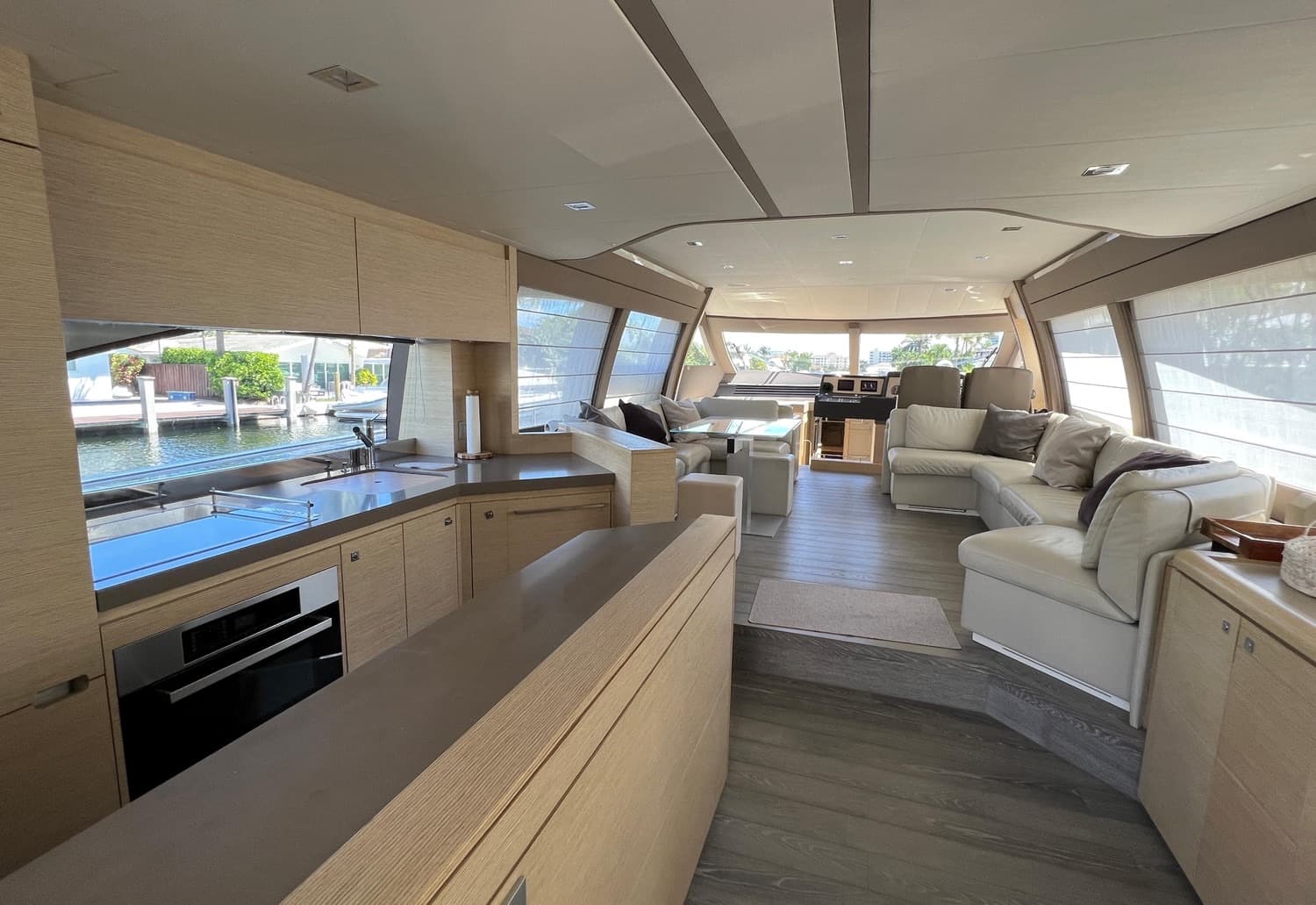 The open gourmet galley and salon finished in light oak.