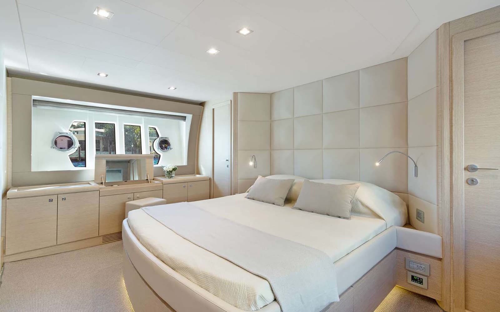 The full-beam master stateroom with a king bed and natural light.